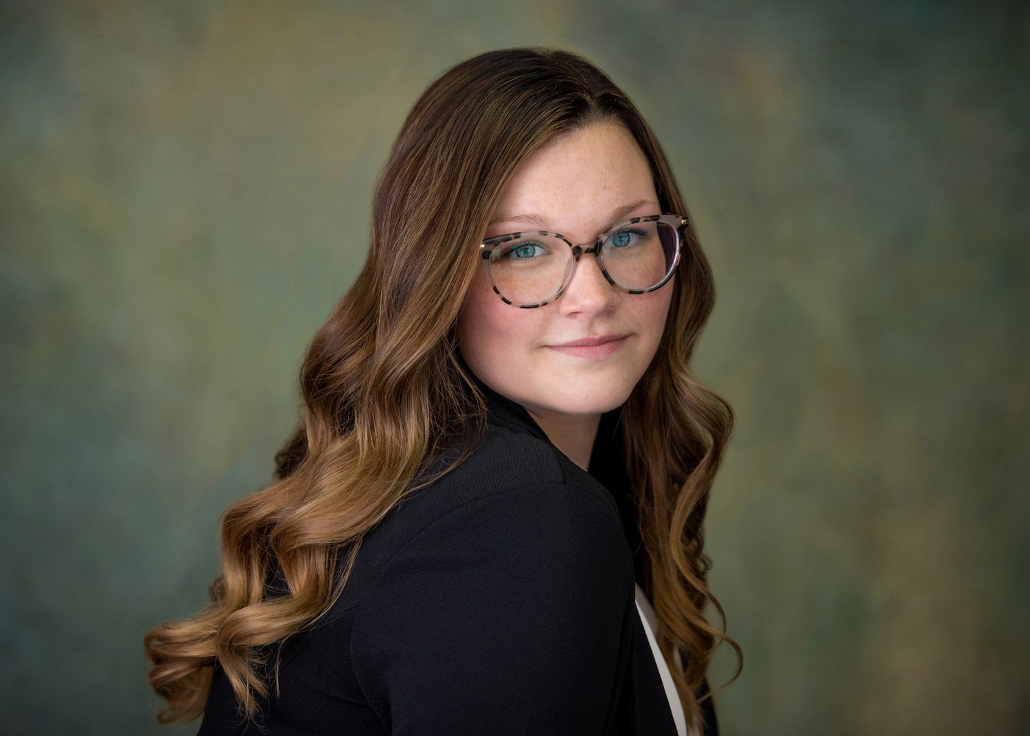 A portrait photo of the author, K Cachera